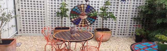 outdoor setting with large mosaics in the courtyard at our mosaic workshop